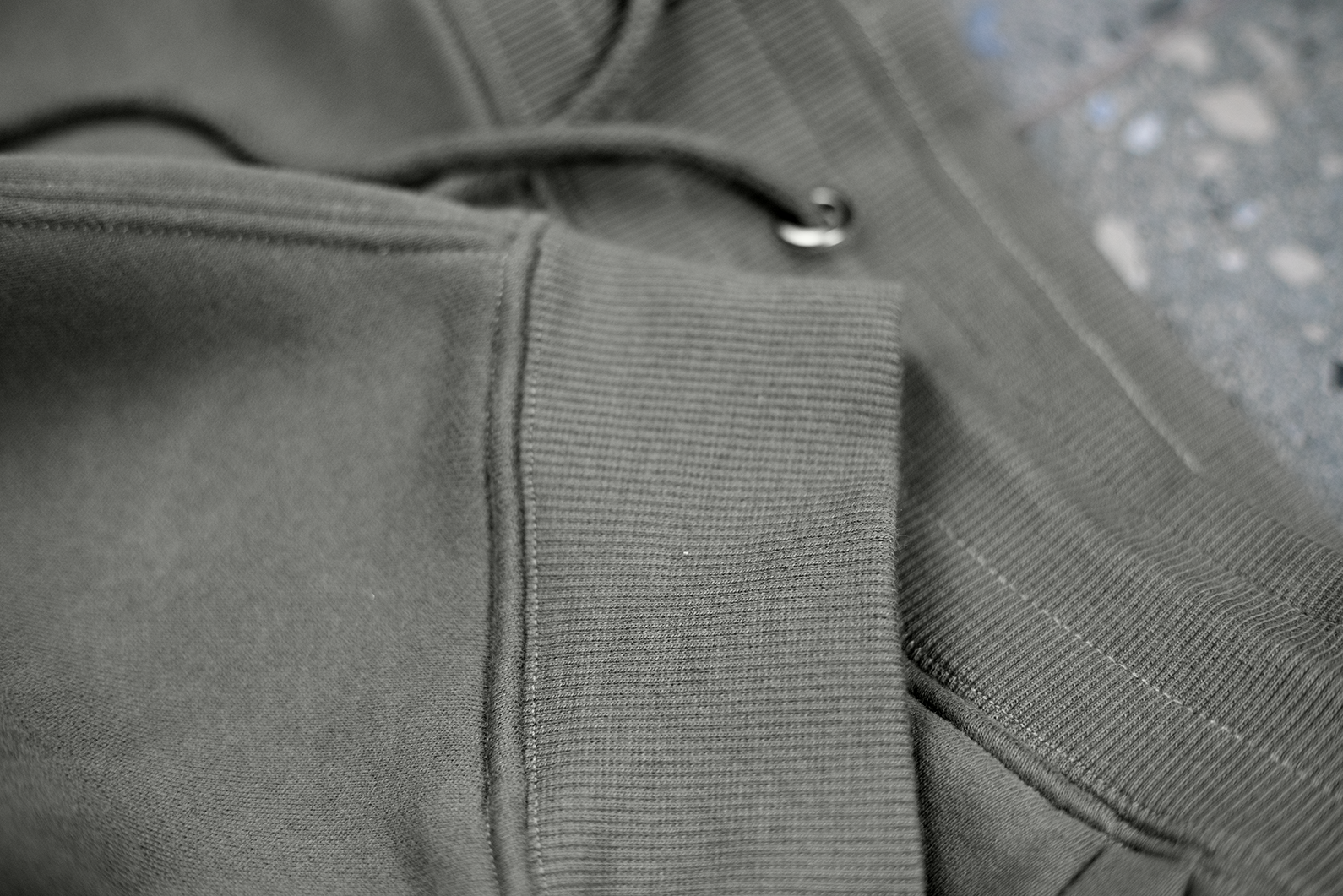 Close-up of curated clothing piece showcasing detailed quality stitching 