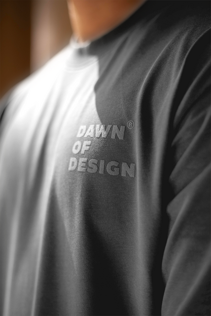 Oversized greyt-shirt worn casually with streetwear staples